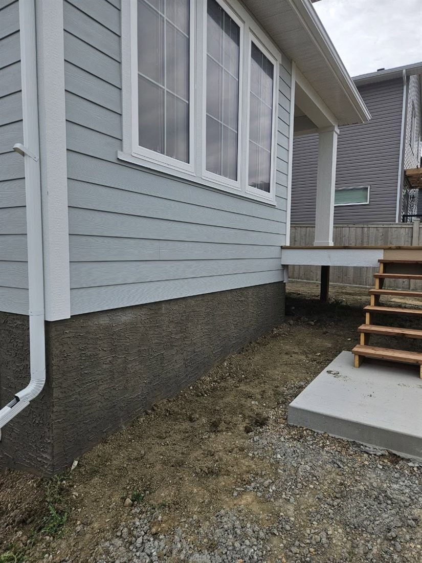 Finished parged foundation on a Lethbridge-area home